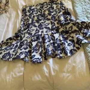 Blue and white skirt with scalloped hemline.